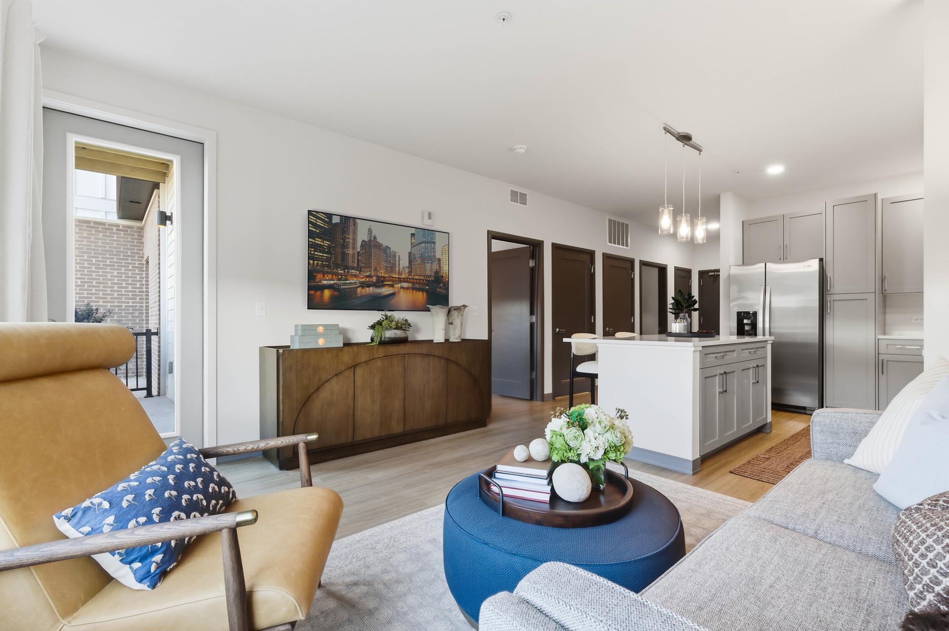 exterior rendering of a brand new three-story apartment building and the parking lot